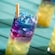 Multicolored mixed beverages on a table from Spellbound, a lounge on board the Disney Adventure